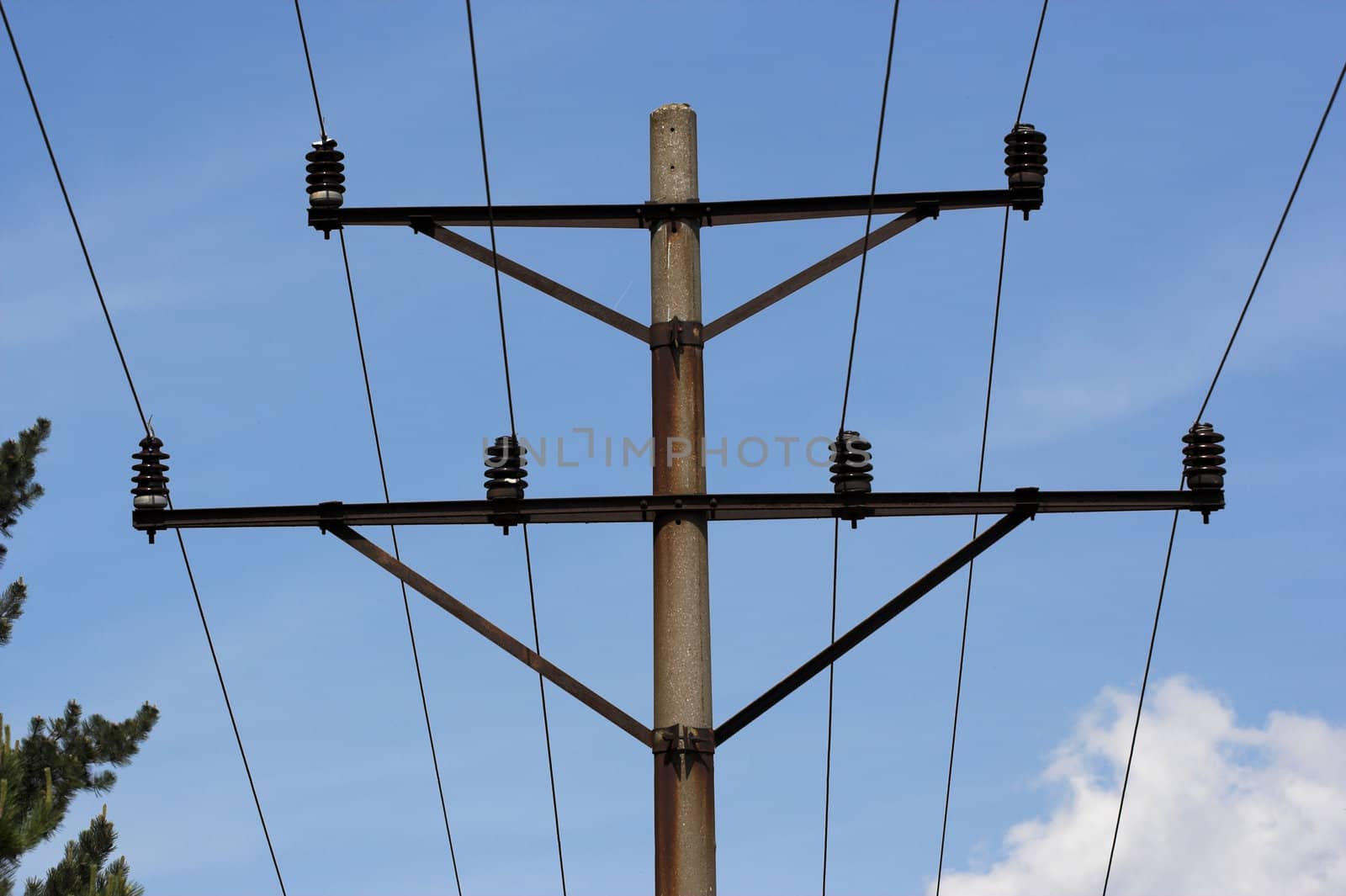 A distribution line over blue sky