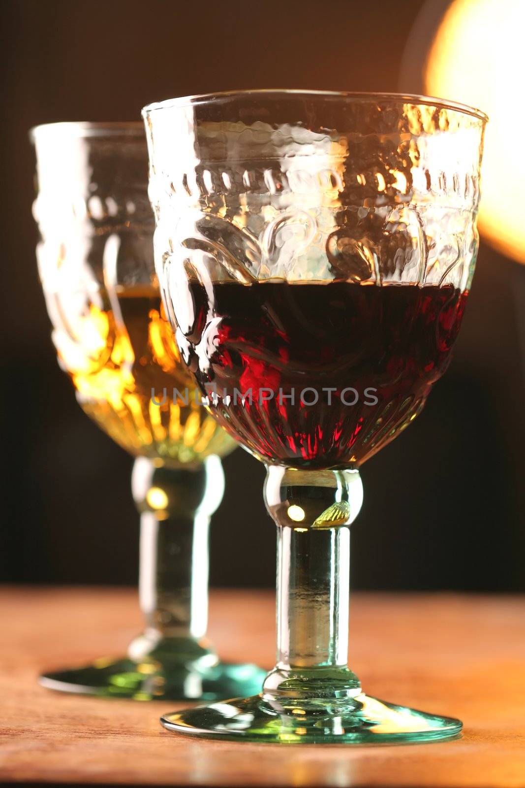 Two Goblets with White and Red Wine in Light Evening Sun, Medieval Style