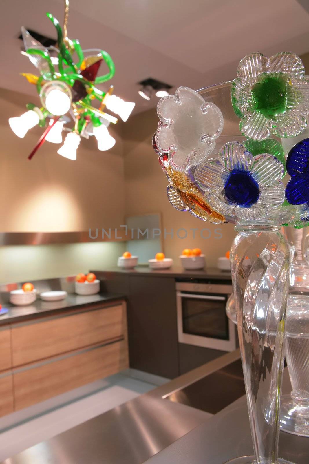 vase with glass flowers in interior of the modern kitchen