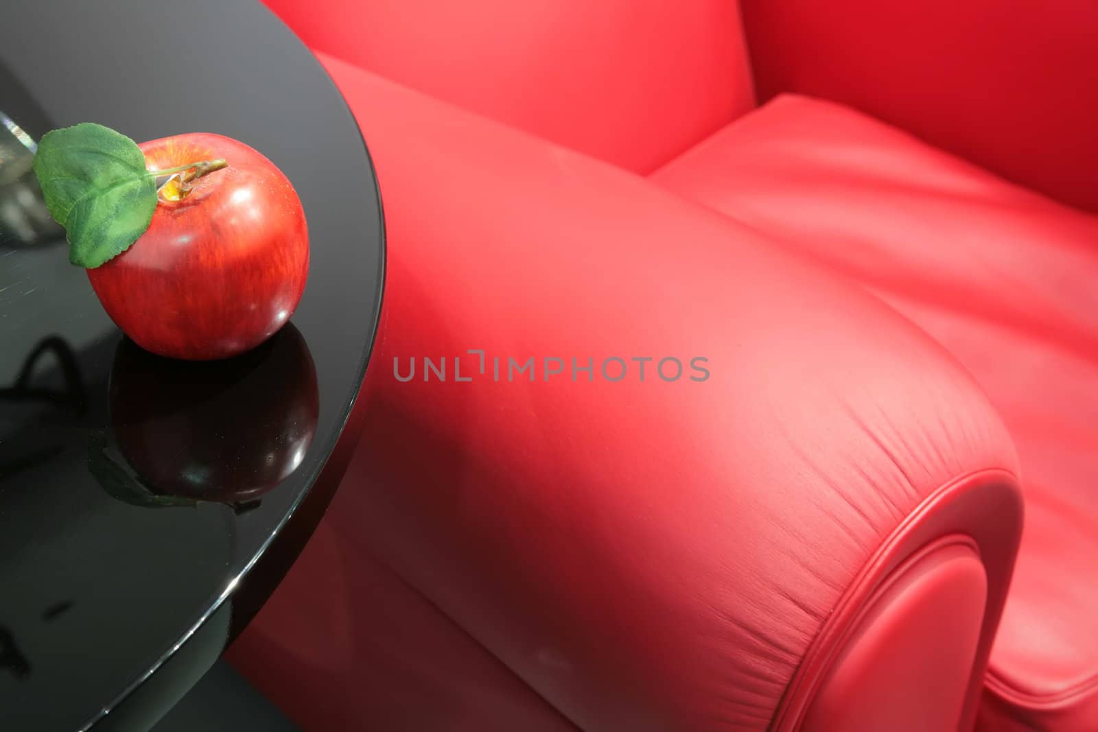 red apple and a red easy chair by Astroid