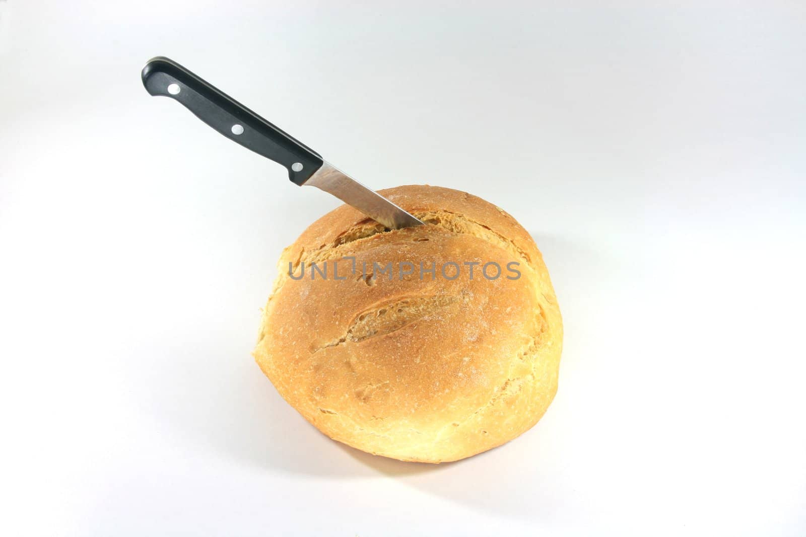 bread loaf with knife closeup food concepts