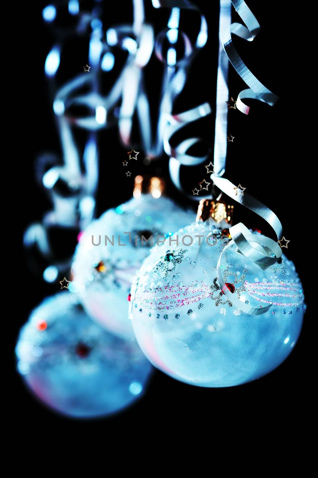 christmas still life with blue balls on black background