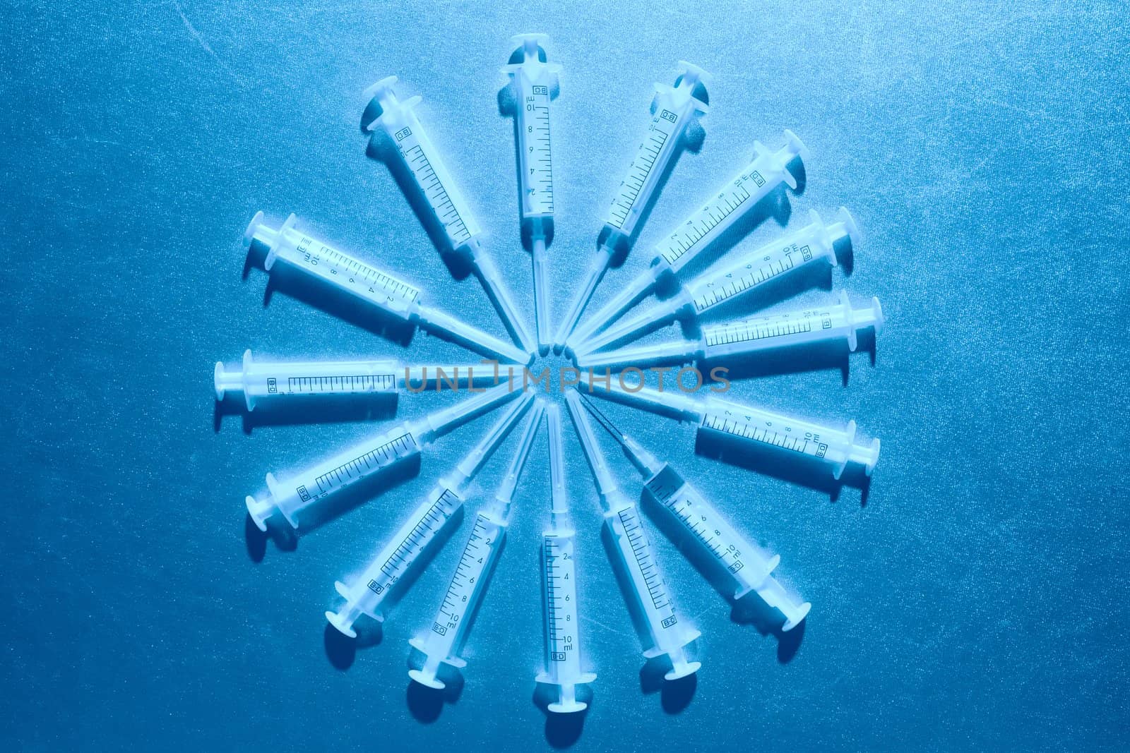 luminous medical syringes liing as rays