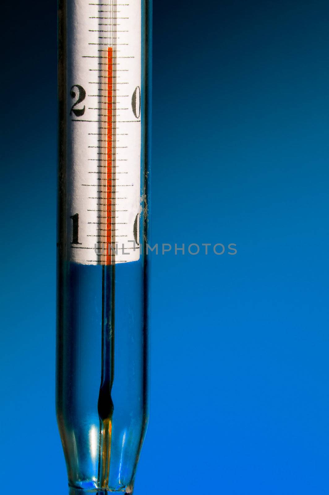 The thermometer on a dark blue background