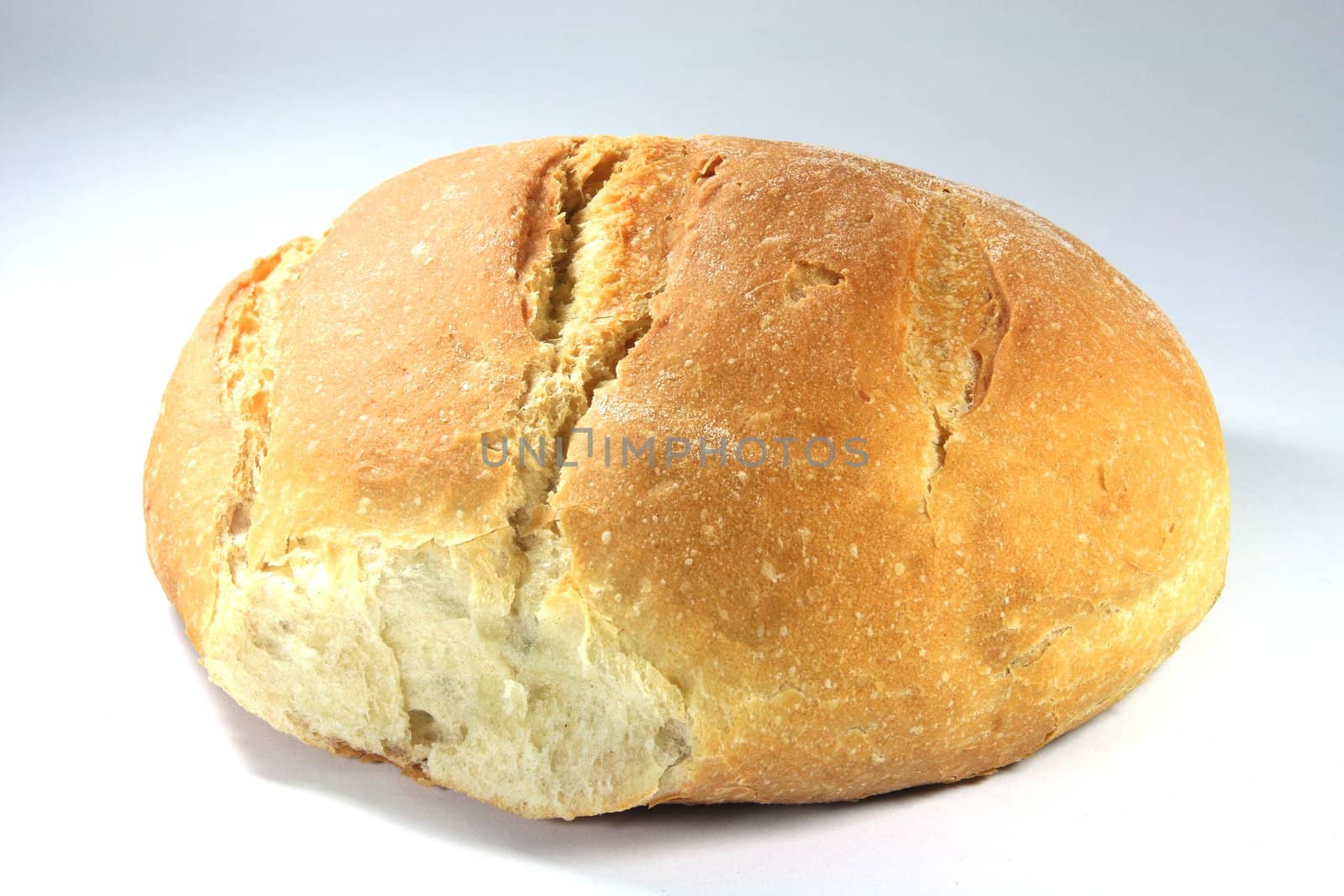 traditional greek bread loaf closeup isolated to white