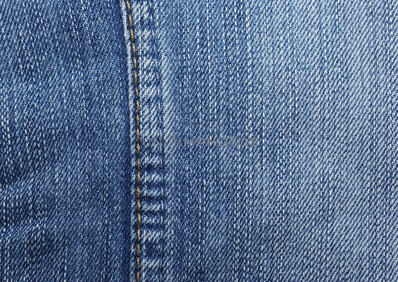 Blue jeans with yellow stitches vertically. Can be used as backg by borodaev