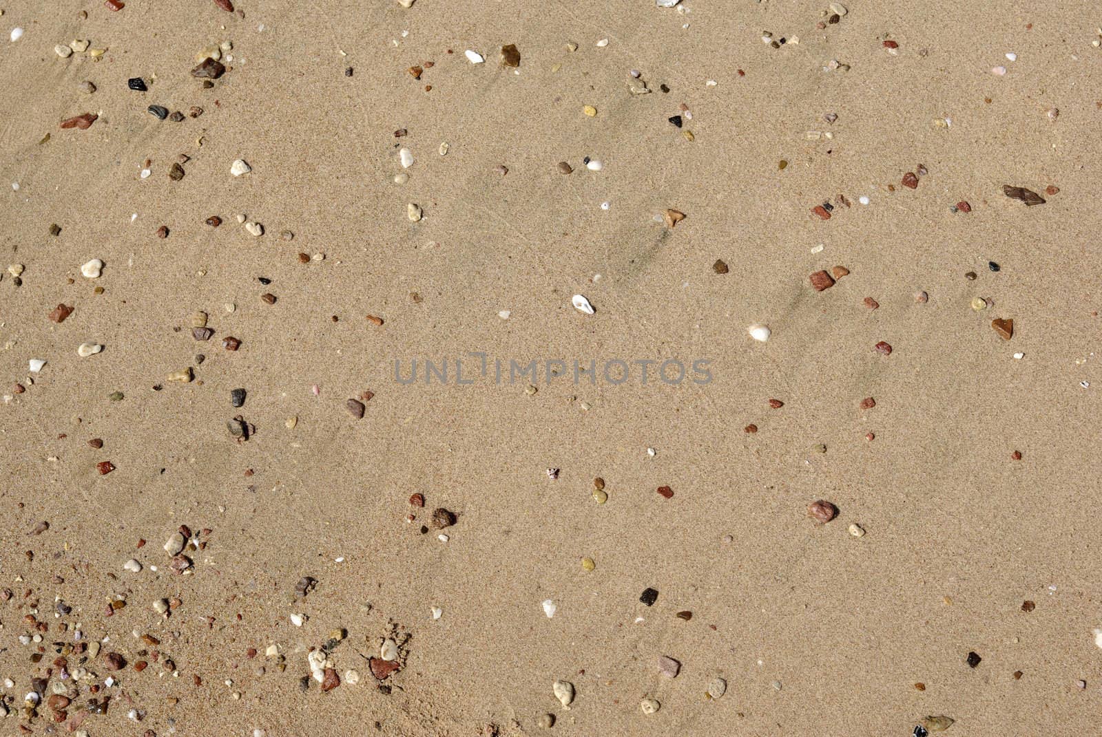 Coastline of Red sea with pebbles and sand as backdrop or background. Egypt, Africa.