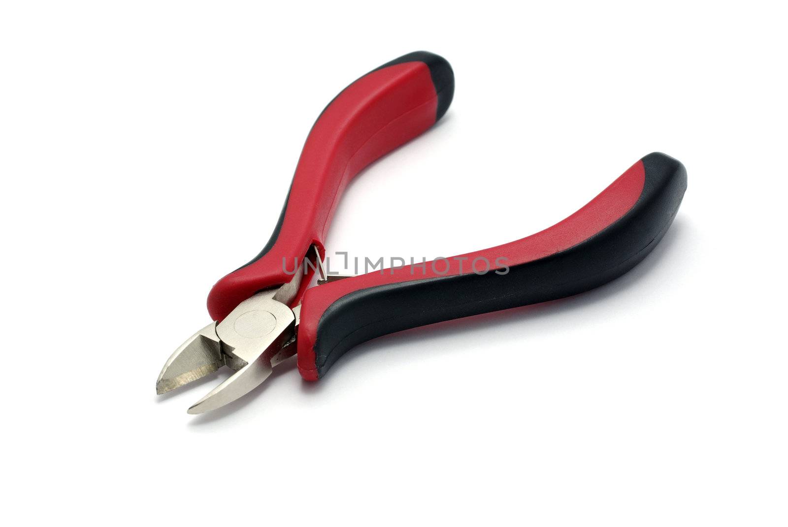 Red with black cutting pliers isolated on white with shadow. by borodaev