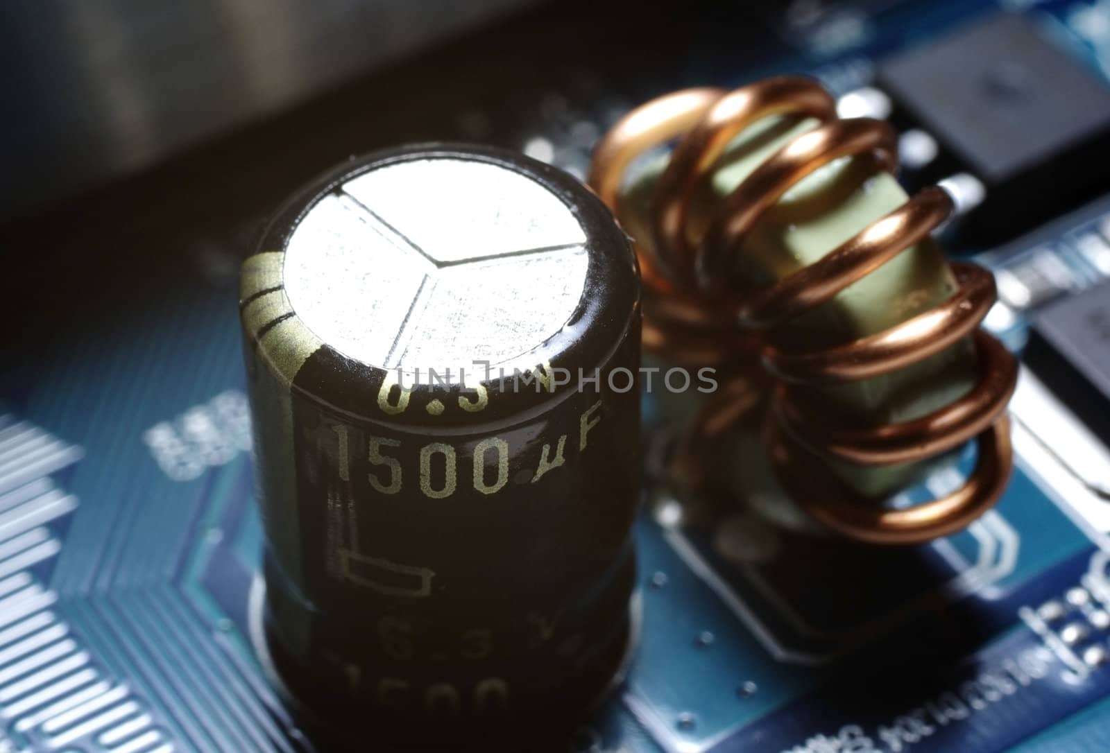 Macro shot of a power supply on circuit board. Abstract backdrop.