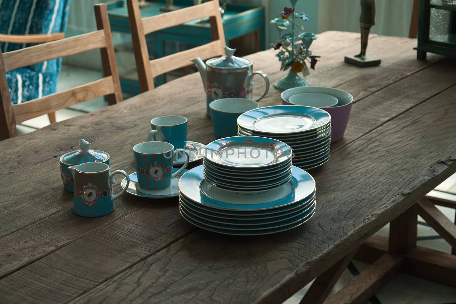 Country style dining room table arranged with traditional dishes