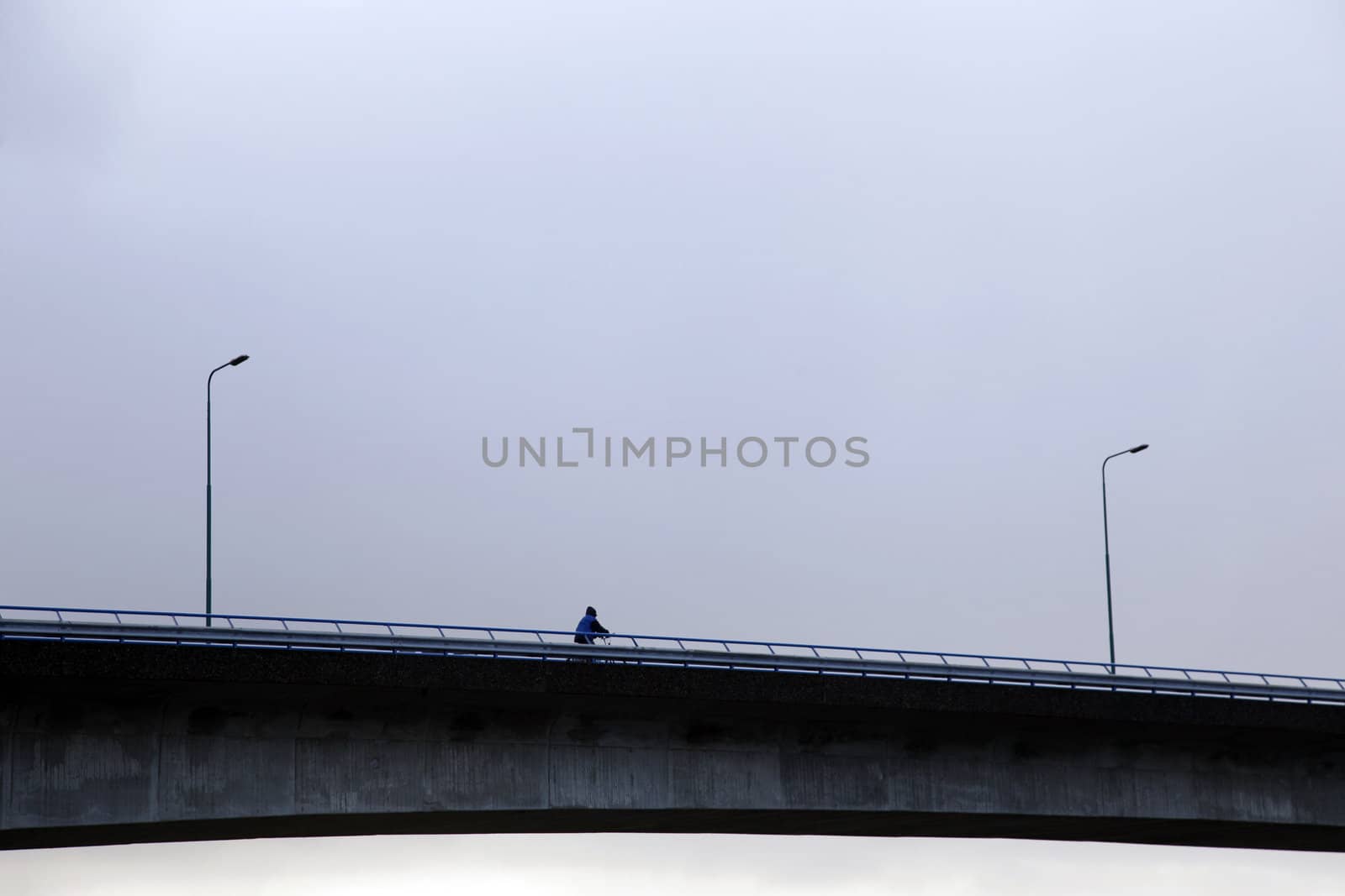 cyclist on bridge by ahavelaar