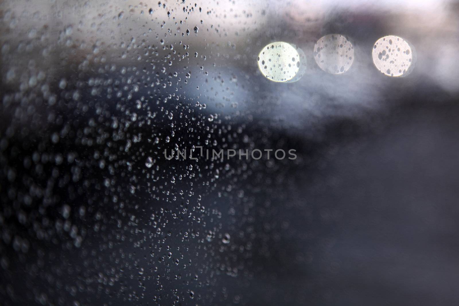 raindrops and light on window