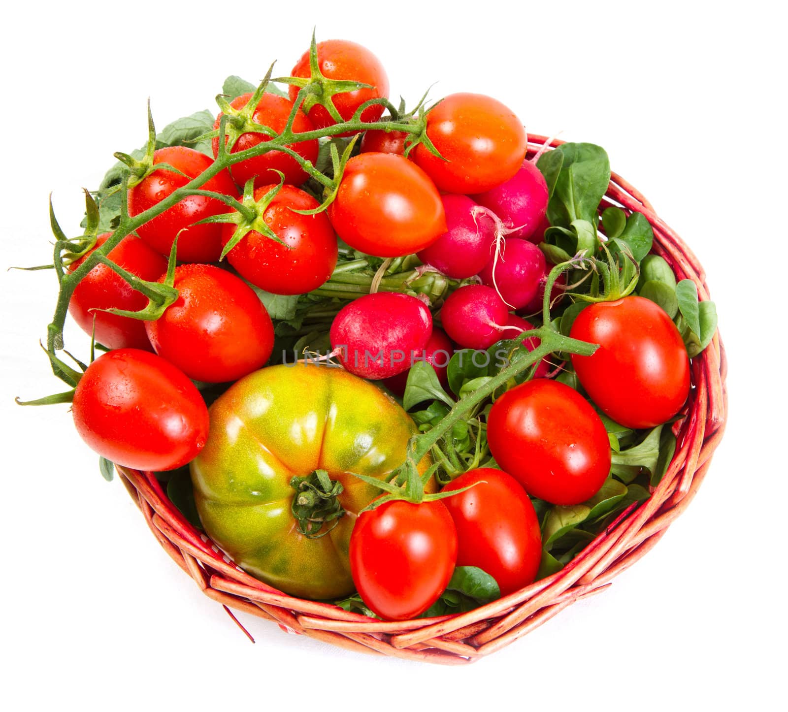 tomatoes in a basket, isolated on white 