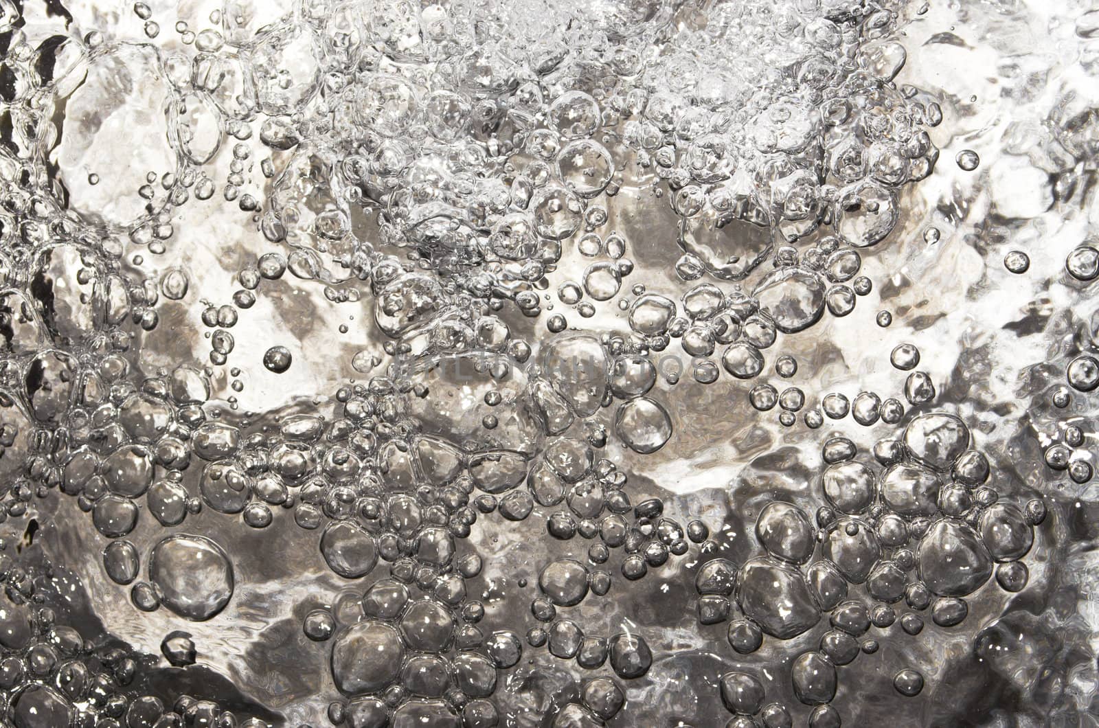 Water bubbles created by directed air stream