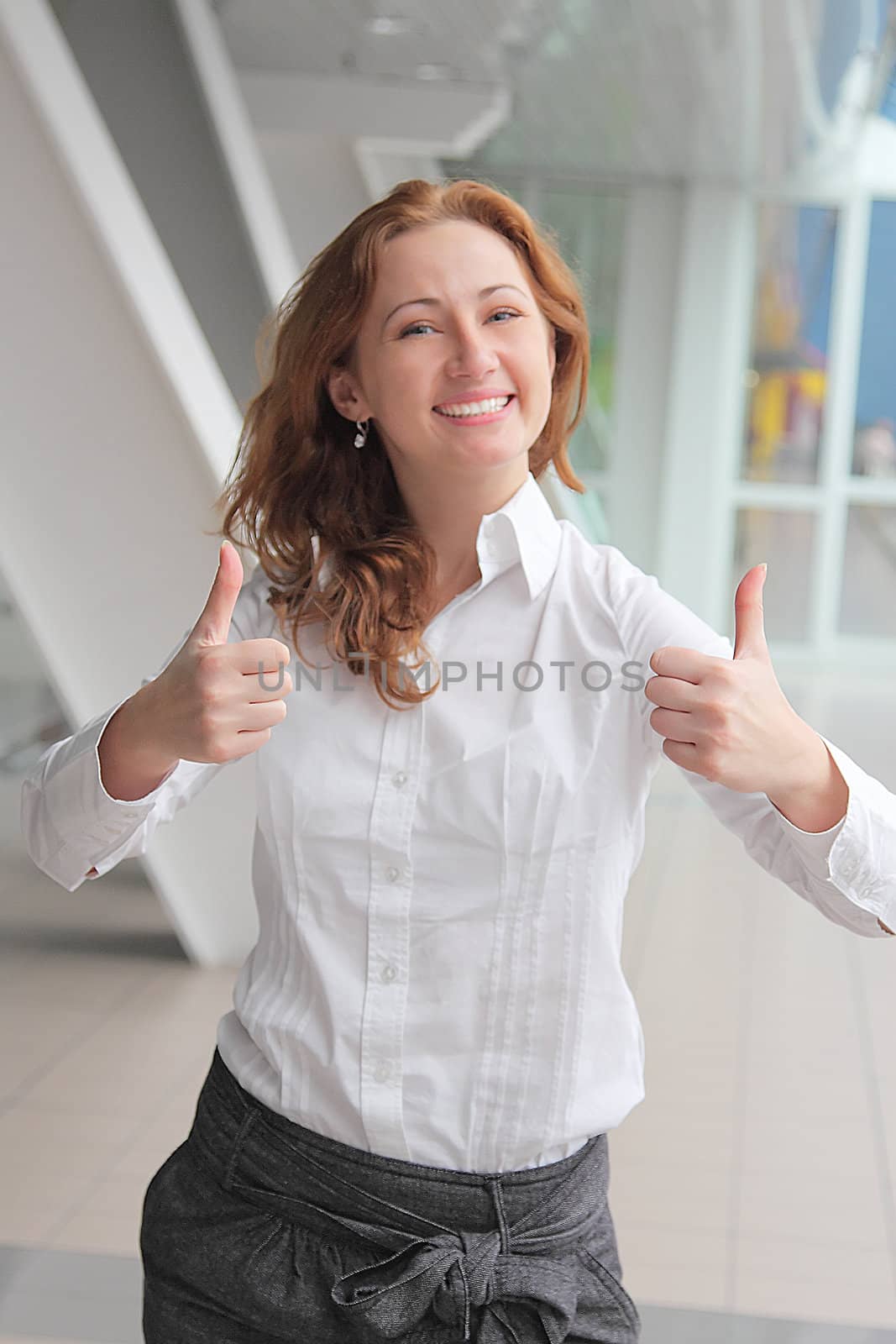 Portrait of the beautiful and young business woman