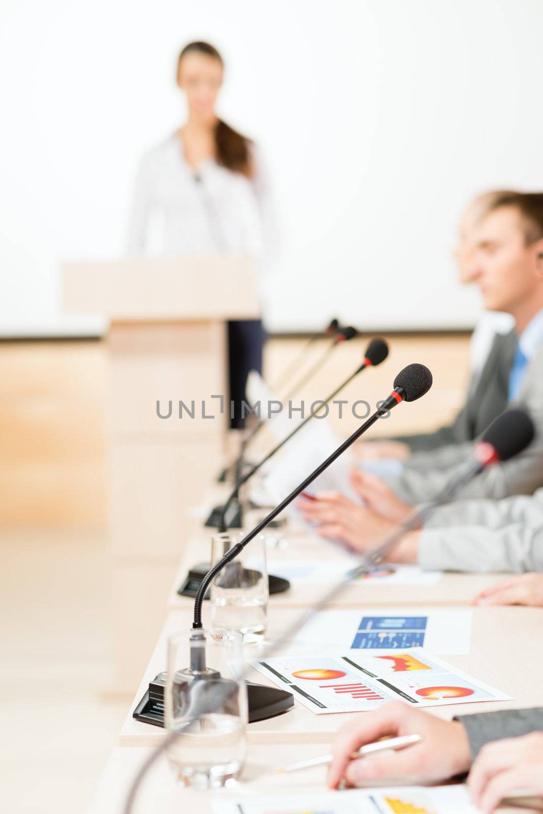 close-up microphone, on the background of business communication at the conference