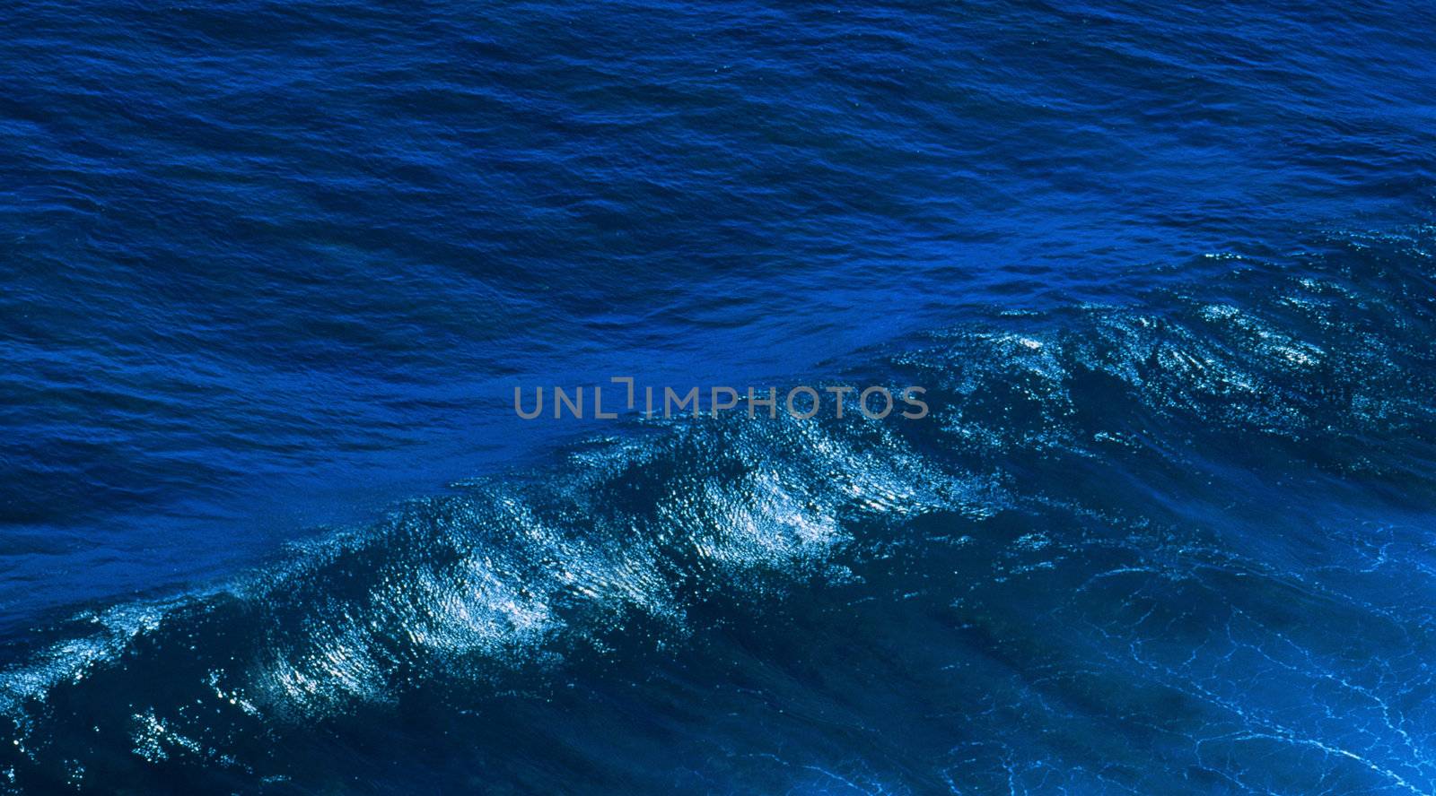 Big ocean wave close up isolated blue