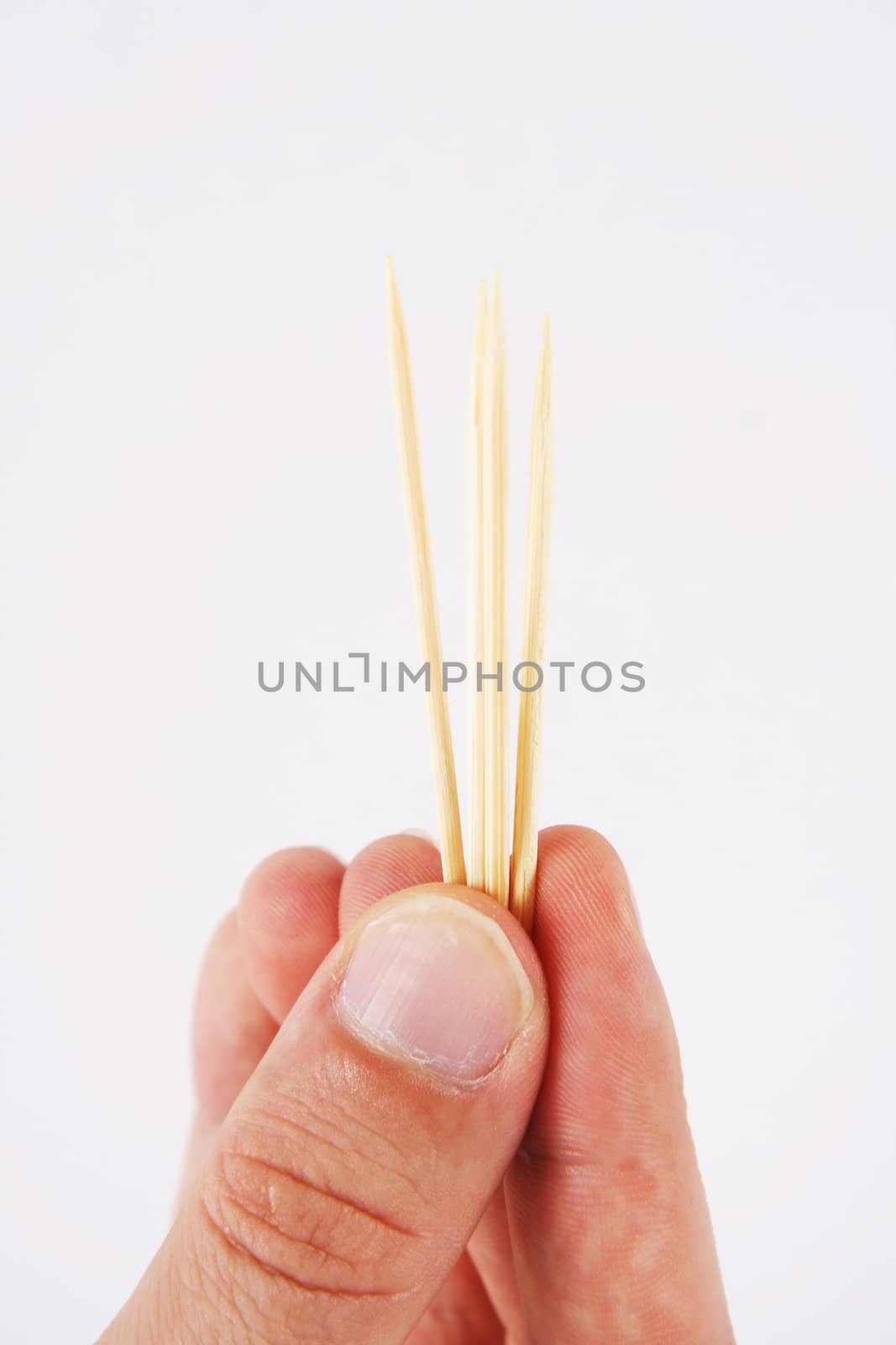 toothpicks and hand