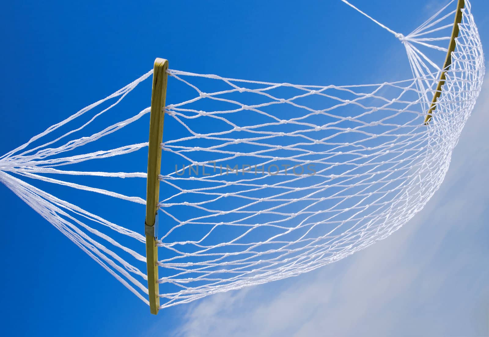 view of nice white hammock on blue sky background