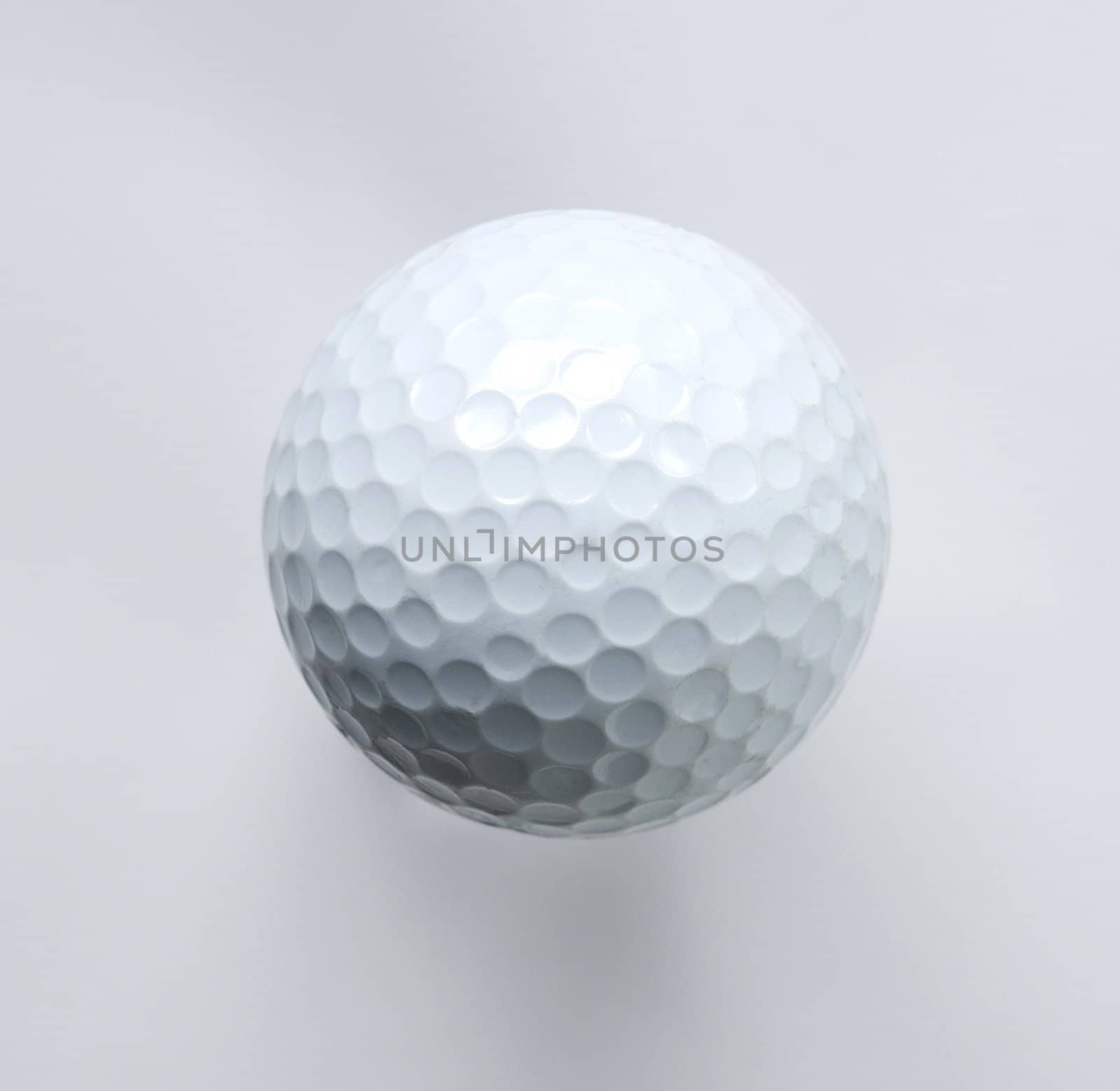 White golf ball isolated on white background