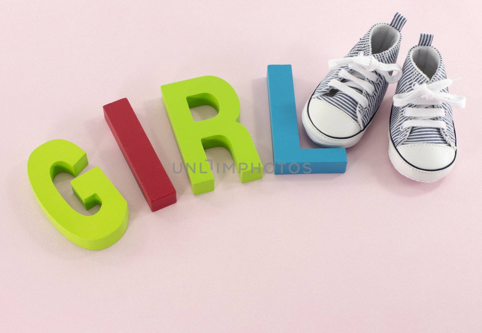 baby shoes with the letters girl