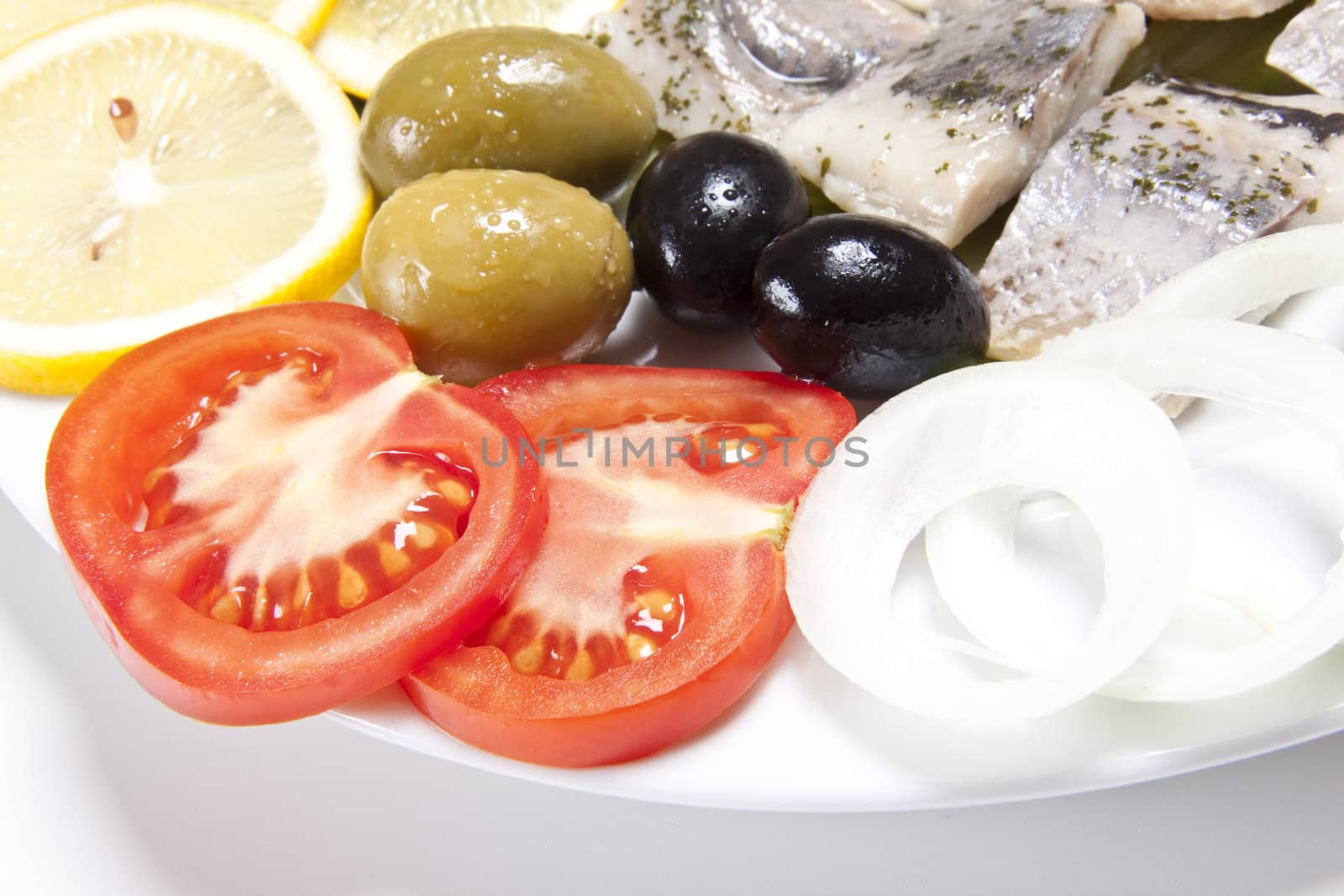 slices fish and tomato slice with onion