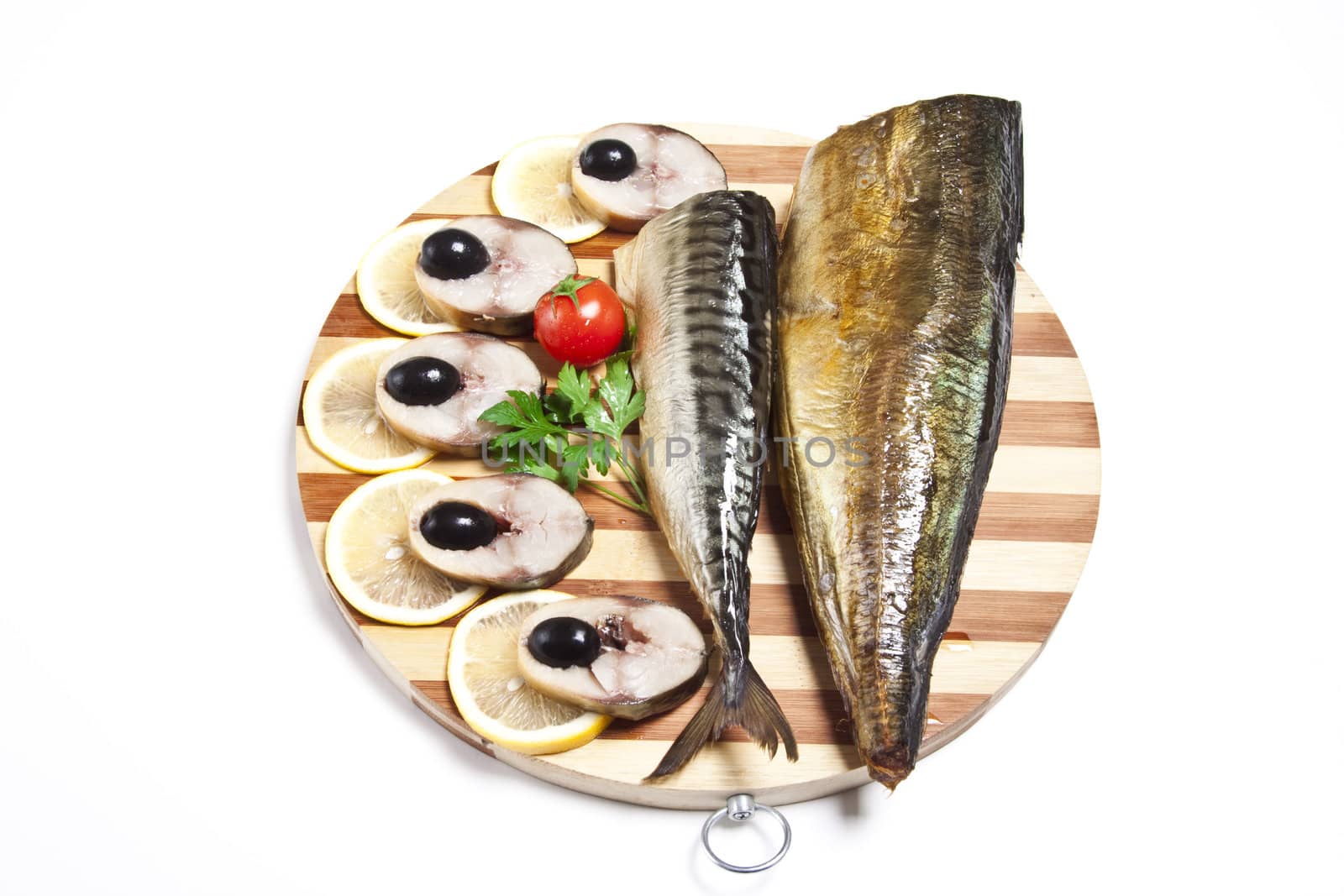 Dish with the cut smoked mackerel on wooden plate