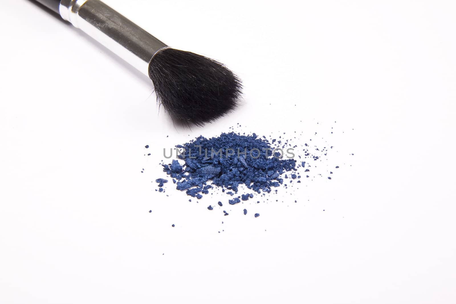 Cosmetic powder and black brush isolated