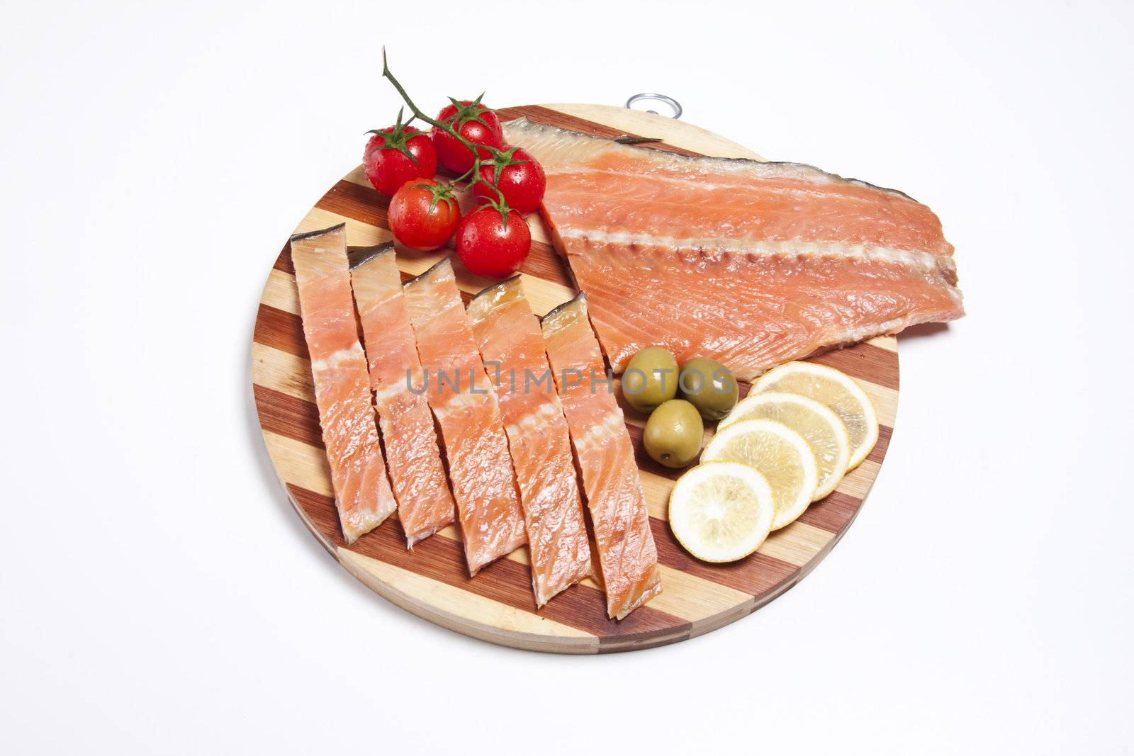 fresh red fish fillet on wooden plate