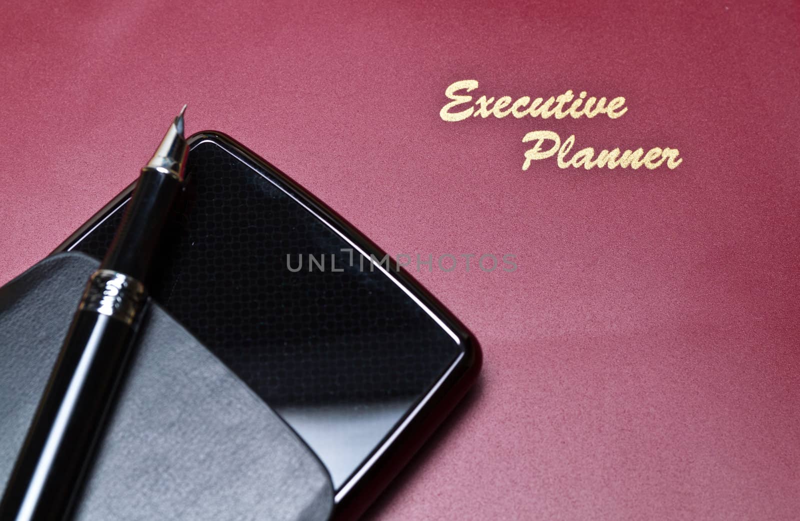 Executive planner with harddisk and pen in landscape orientation