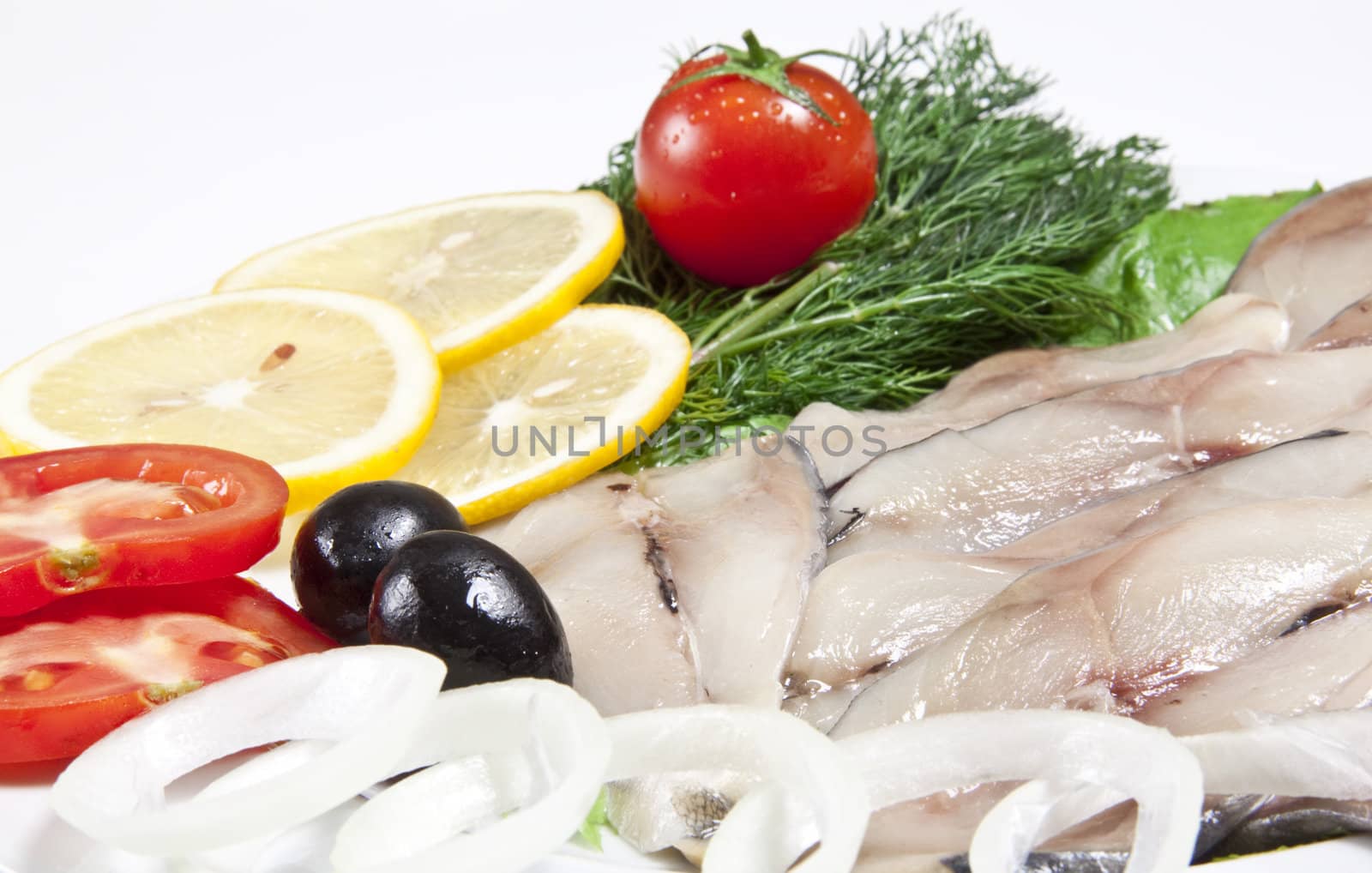 macro picture of fillet herring with vegetables
