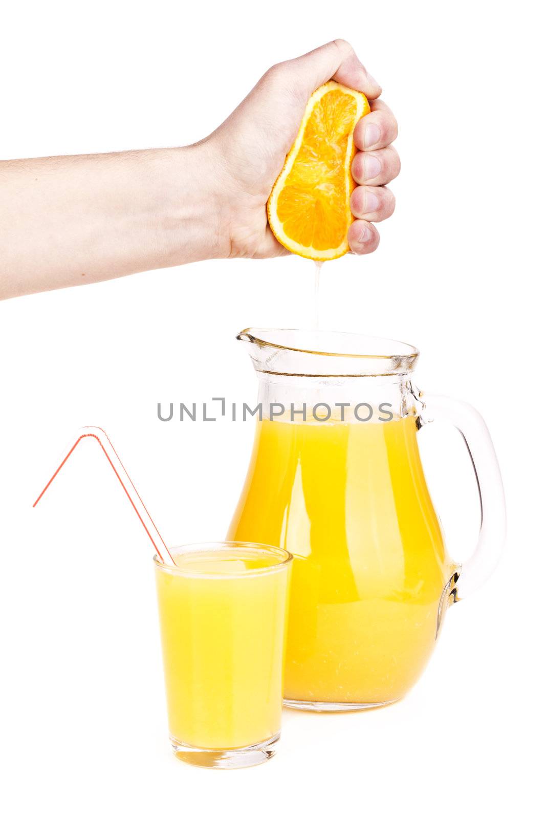 orange juice pouring into glass