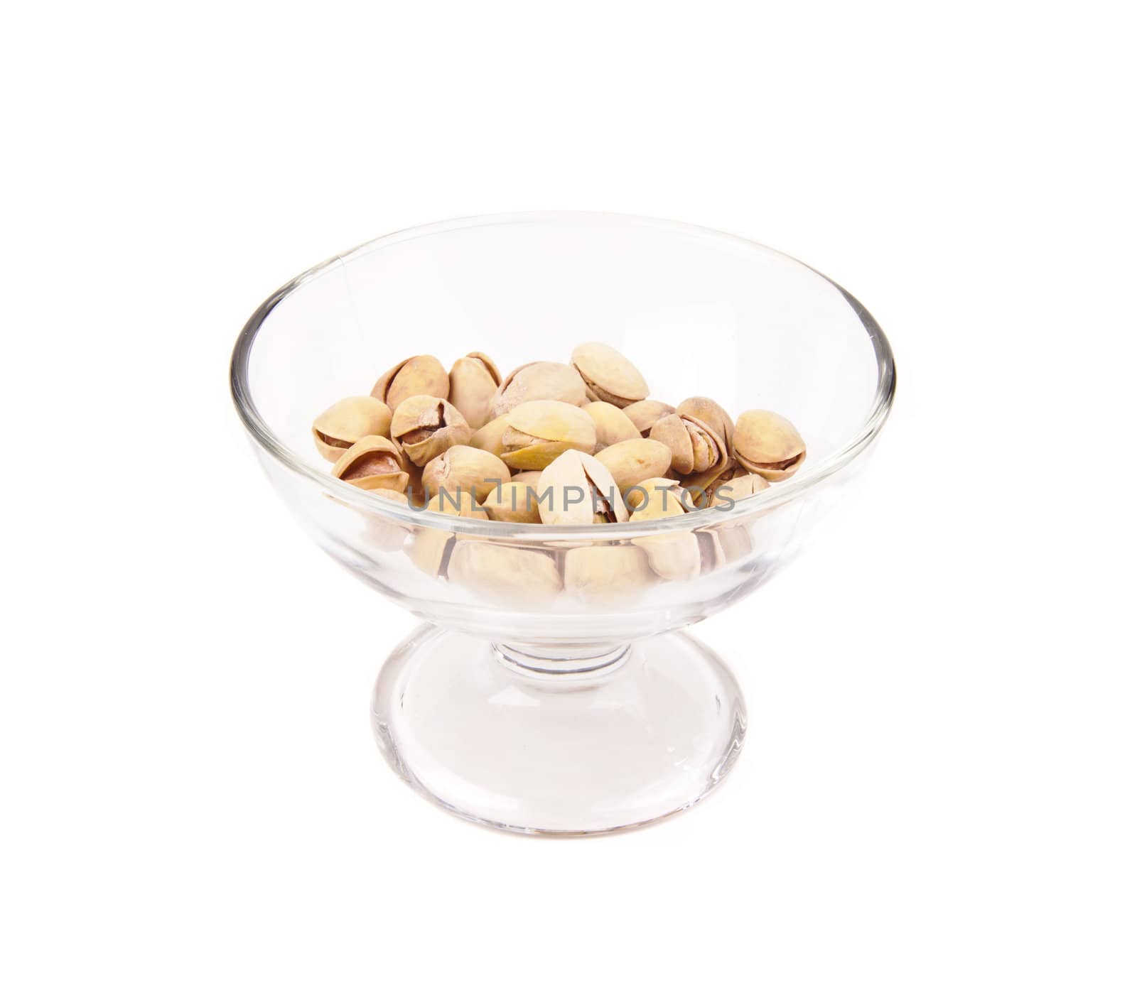 Roasted, shelled, and salted peanuts in a glass bowl