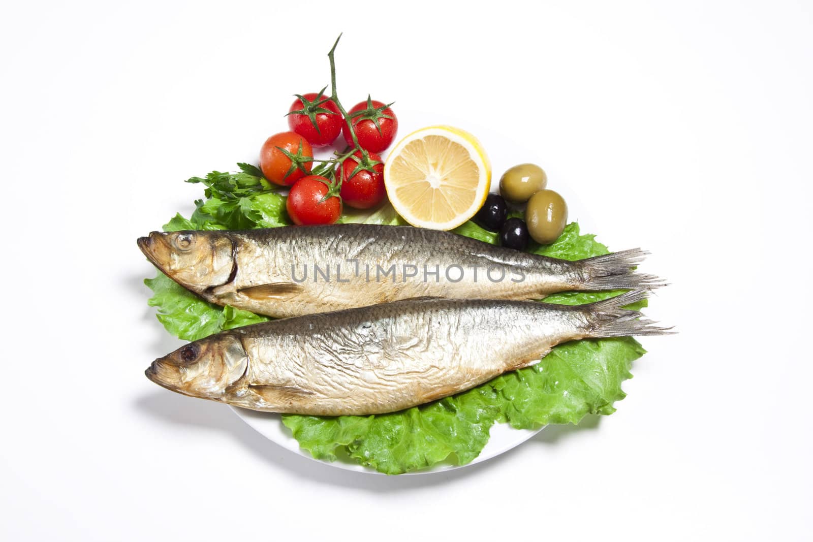 Smoked sprat-appetizing snack with tomato and lemon