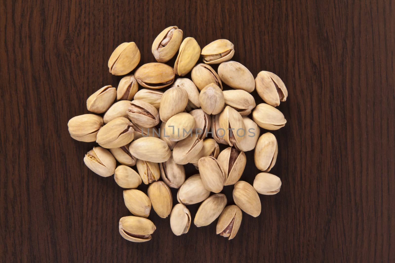 shelled pistachio on wooden