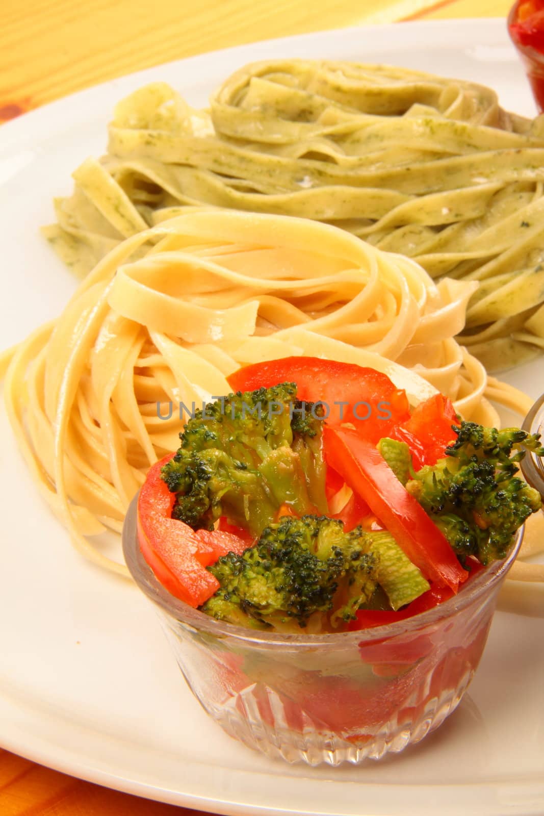 two italian tagliatelles and tomato with brocli condiments