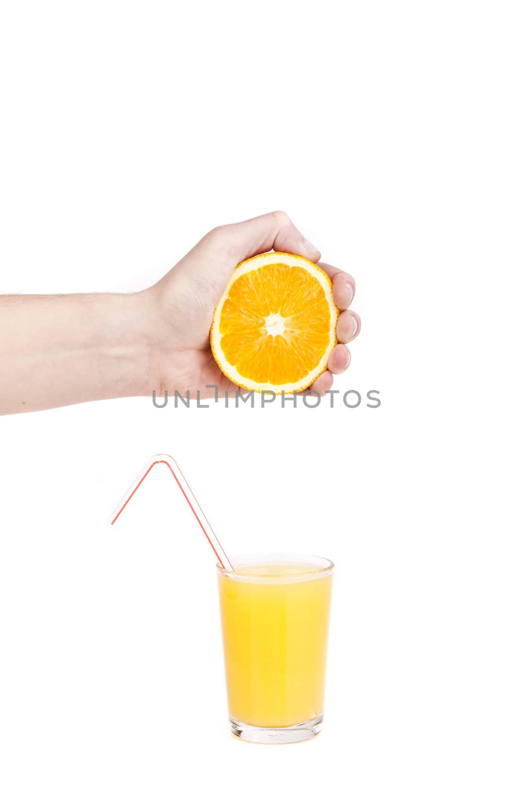 hand pour orange juice from orange