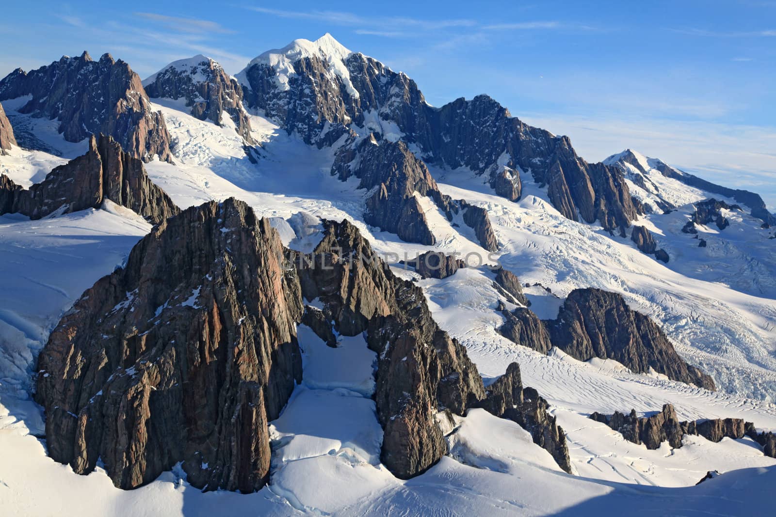 aerial view of Mountain Cook Peak with mist and snow from Helicopter, New Zealand