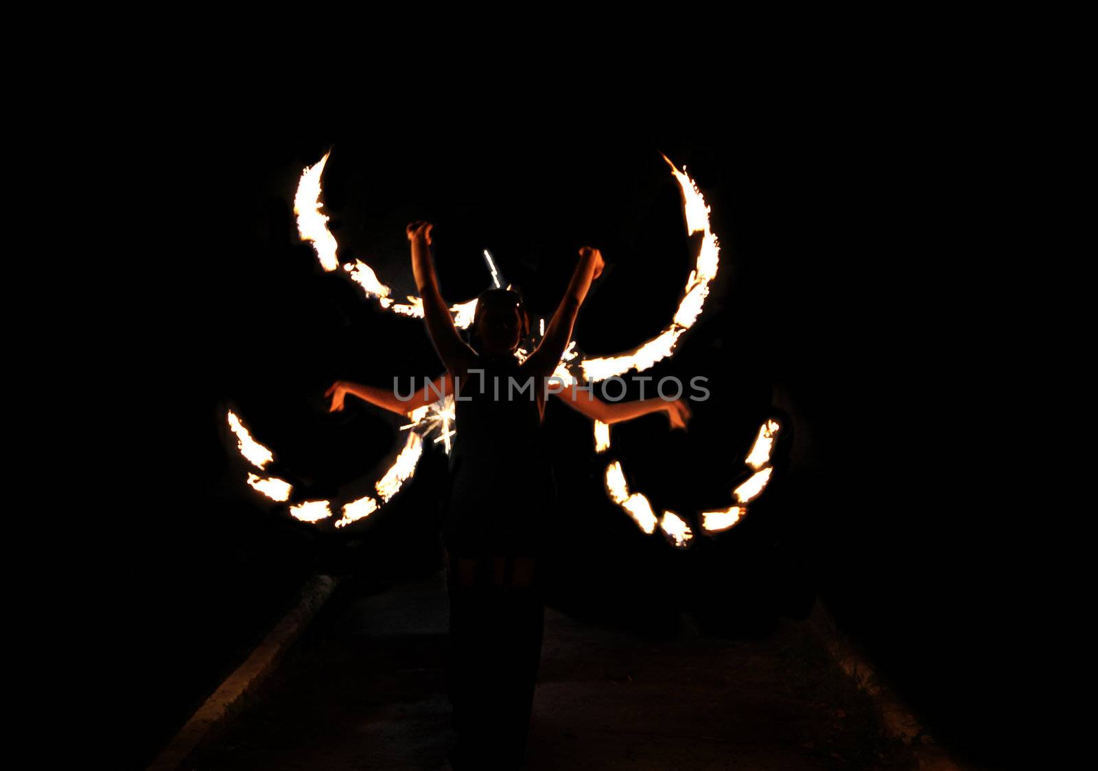 Image of dance with fire at night