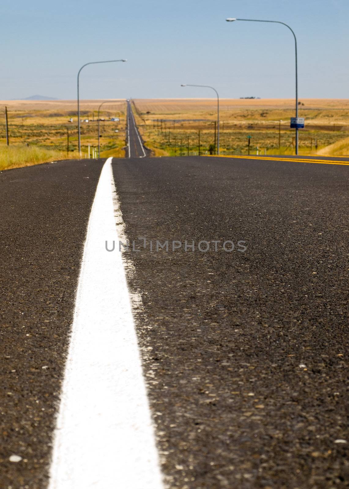 Straight Line Highway in the Country on a Clear Sunny Day