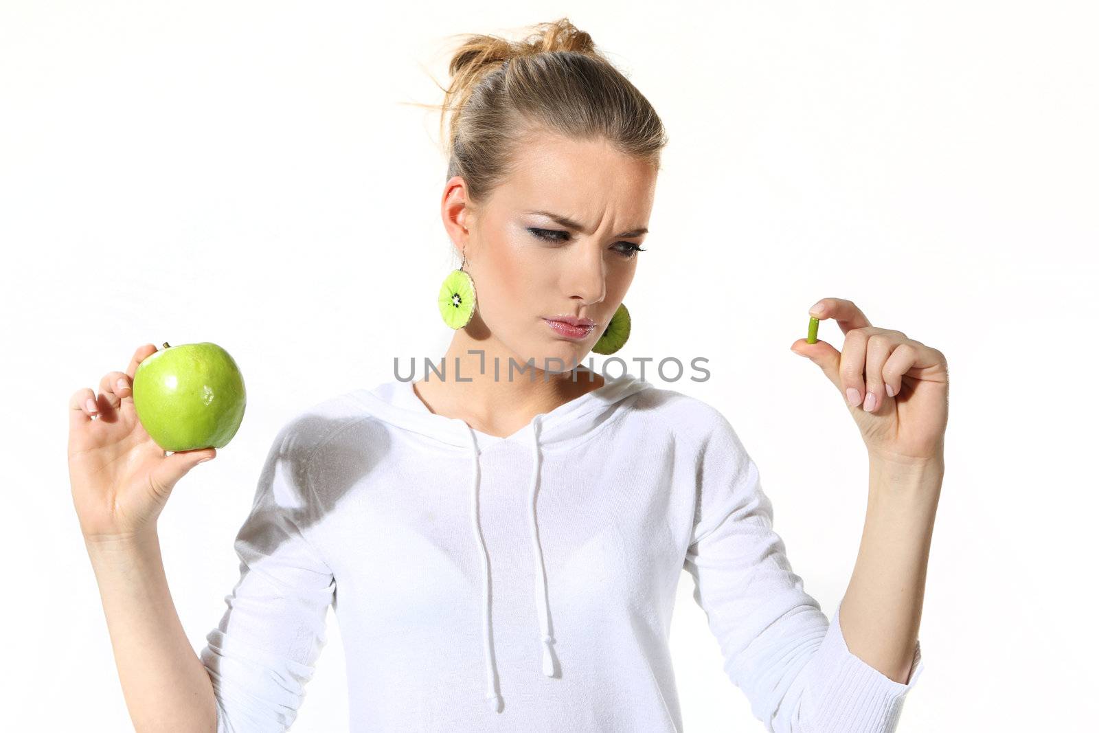 Girl with a green apple on a white background by robert_przybysz