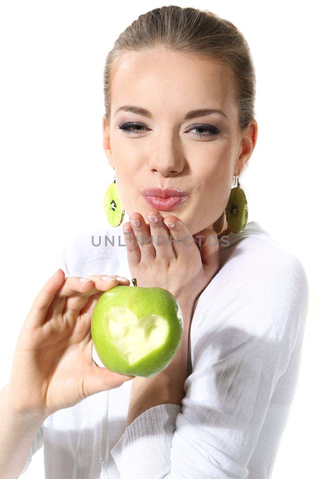 Girl with a green apple on a white background by robert_przybysz