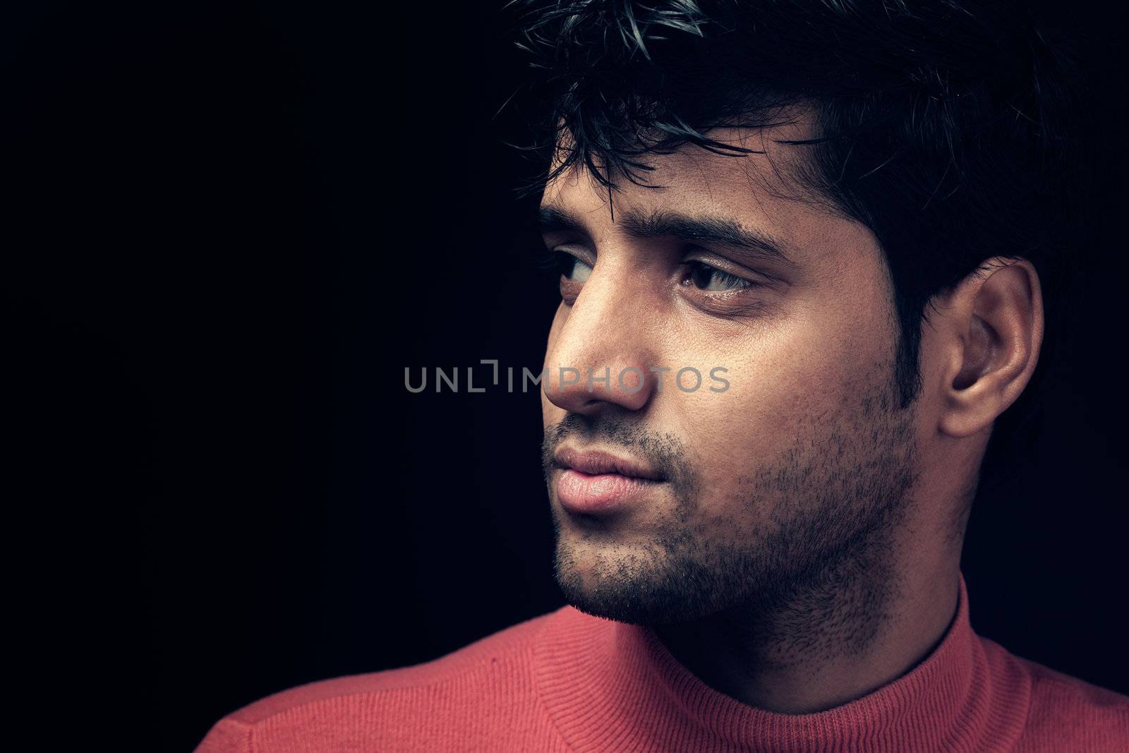 Grains & textures are added in the portrait of Indian man over dark background