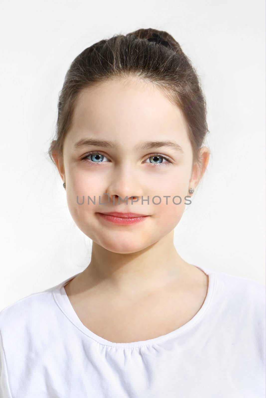 Blue-eyed girl on a white background