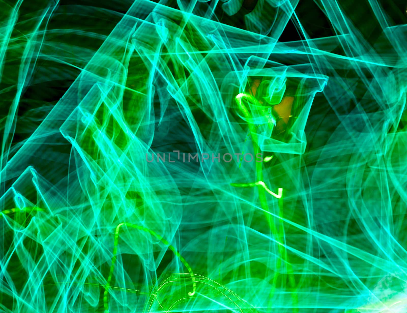 Green light painted streak on a black background