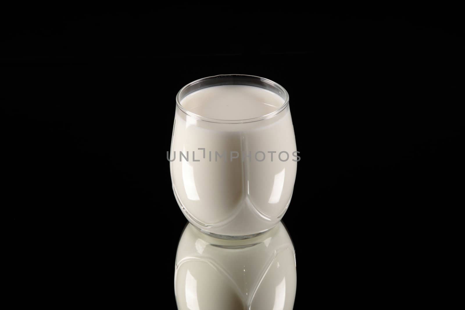 milk glass on black background