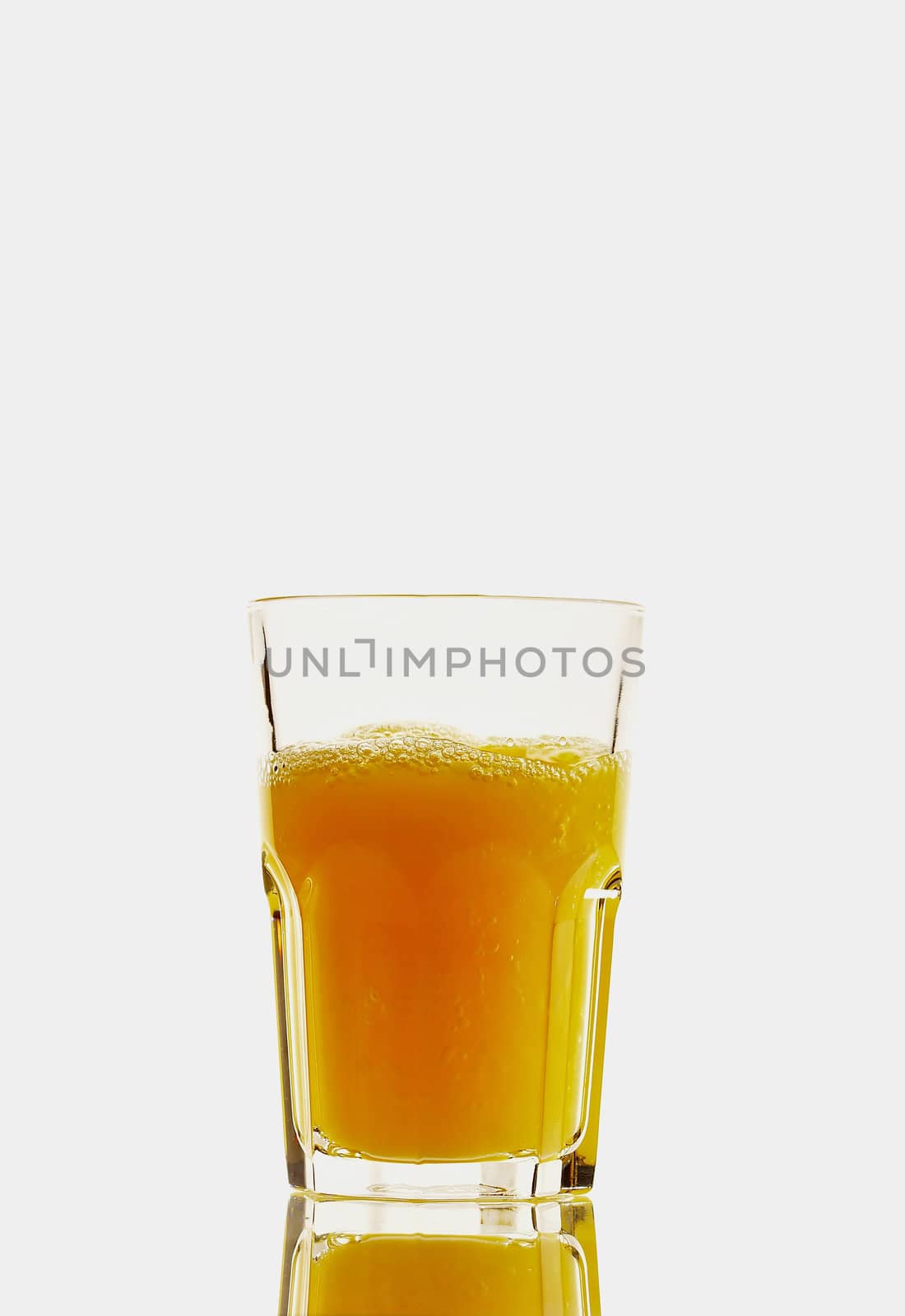 Glass with orange juice isolated on the white