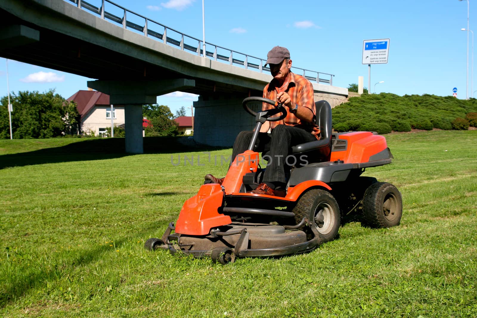 Man on a riding lawn mower