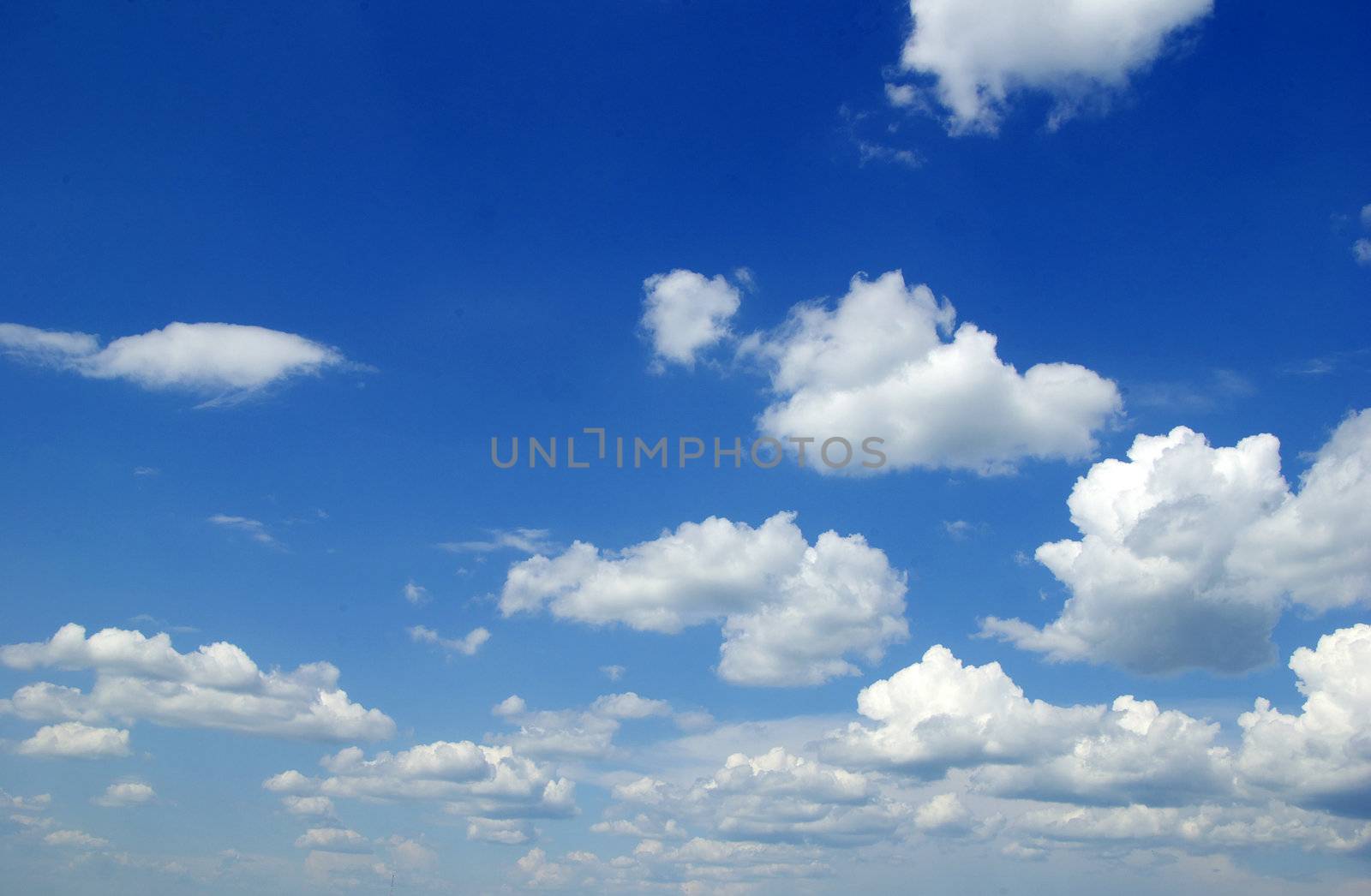 blue sky background with tiny clouds