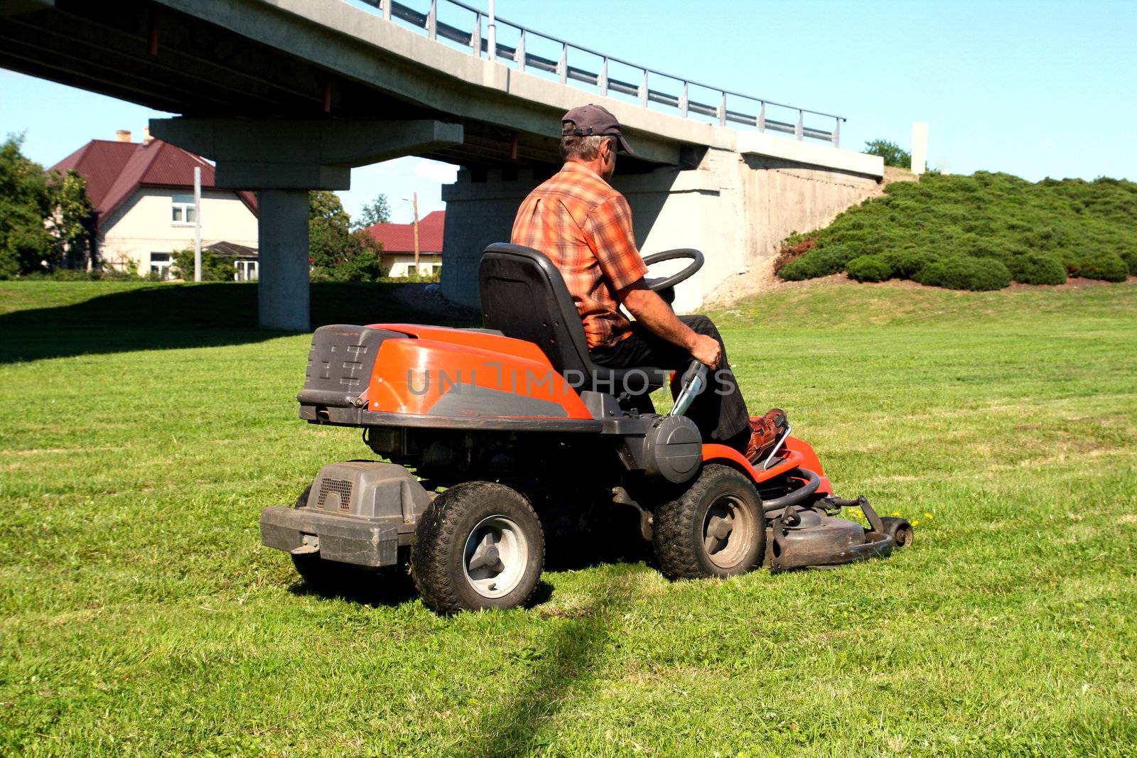 Man on a riding lawn mower